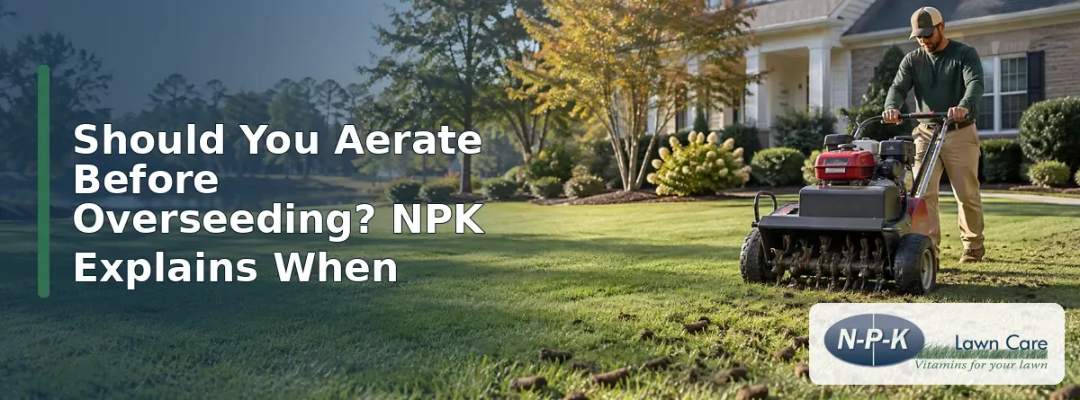 Lawn care worker using a core aerator on a green residential lawn in South Carolina